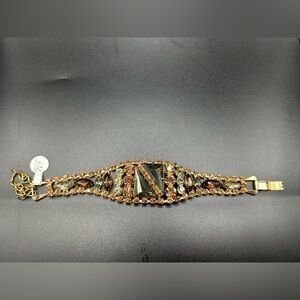 Vintage brown, amber, and black rhinestones bracelet set in gold-tone metal.